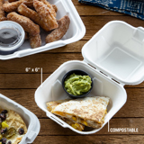 cheesy quesadilla with a small side of guac in a small square shape compostable takeout container	