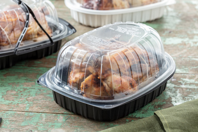 rotisserie chicken inside of a rotisserie chicken container	