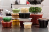 variety of round takeout containers for soups and dips