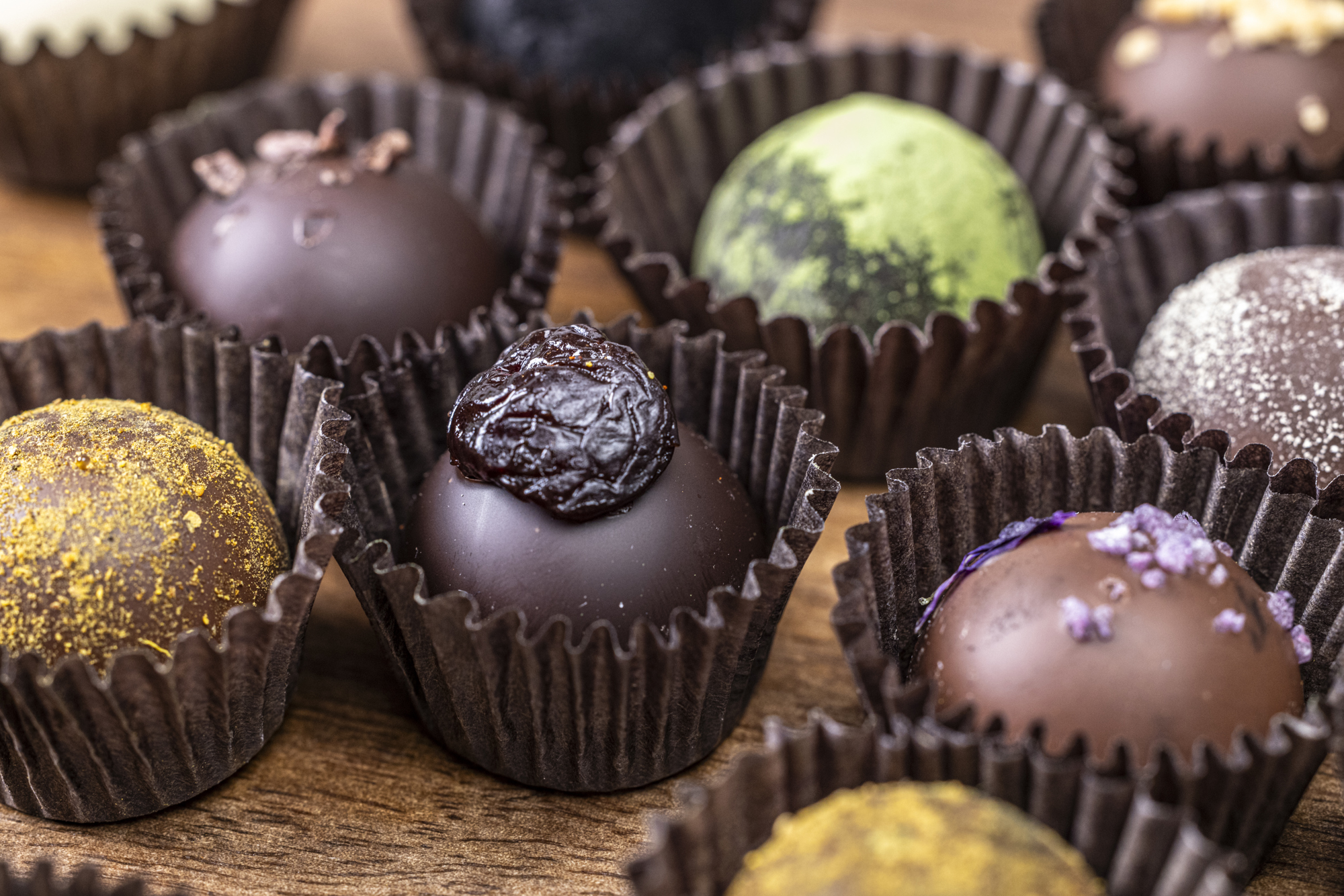 small round chocolate candies in small cupcake liners