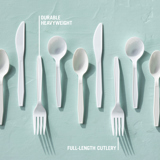 several cutlery sets laying down on a flat surface	