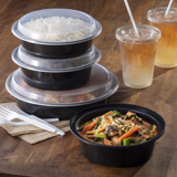 round takeout containers with clear lids stacked on top of each other	