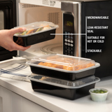 microwavable takeout containers stacked up on top of each other next to a microwave