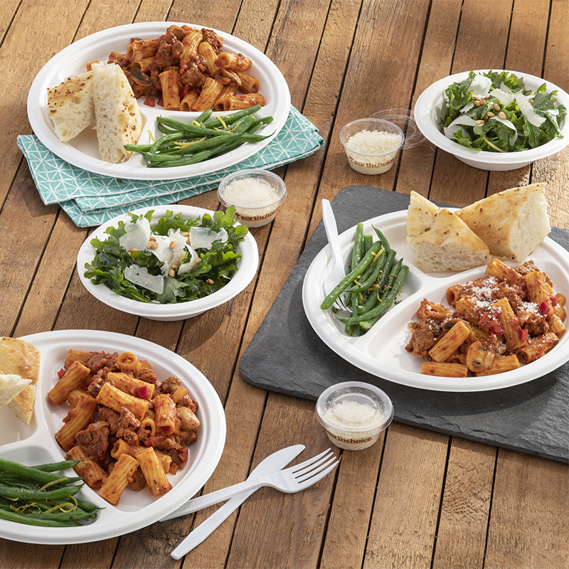 dinner food on three divider plates and side salad plates