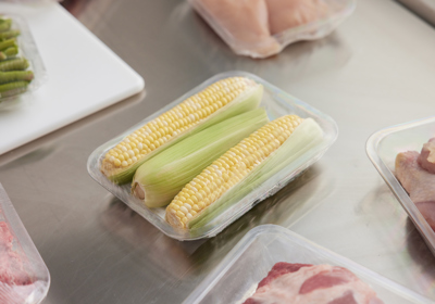 corn on the cob in a clear tray