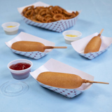 boat shaped container with a corn dog inside	