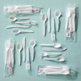 several cutlery sets laying down on a flat surface	