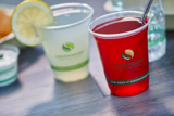 clear greenware cups with iced beverages inside