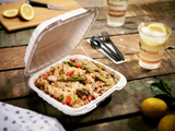 stir fry vegetables with rice in a takeout container	