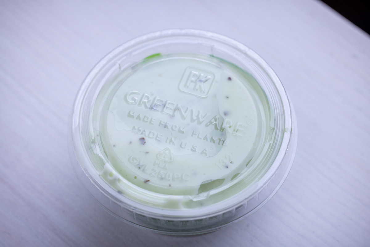 clear greenware round container with dip inside	