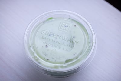 clear greenware round container with dip inside	