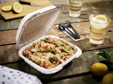 stir fry vegetables with rice in a takeout container