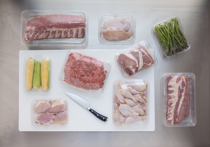 Variety of clear meat trays with a different chicken and beef meats