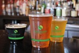 clear greenware cups with iced beverages inside	