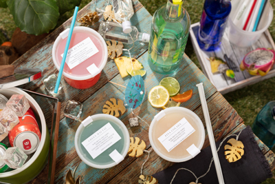 variety of different beverages in clear containers with straws	