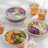 fresh poke bowls in takeout containers and iced tea in a clear cold beverage cup	