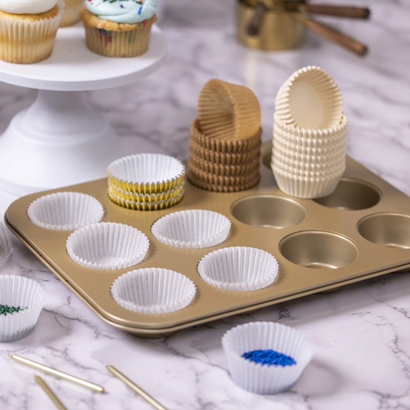 Bakery liners in a baking sheet on a counter	