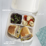 sub sandwich cut in half with a side salad and side of cauliflower in a compostable divider takeout container with three sections	