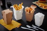 four french fry containers with french fries inside